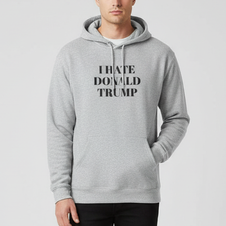 Person wearing a gray hoodie with 'I HATE DONALD TRUMP' text on a light gray background