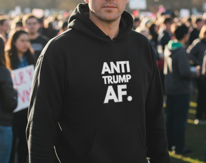 Man wearing a Black hoodie with the quote "Anti Trump AF"